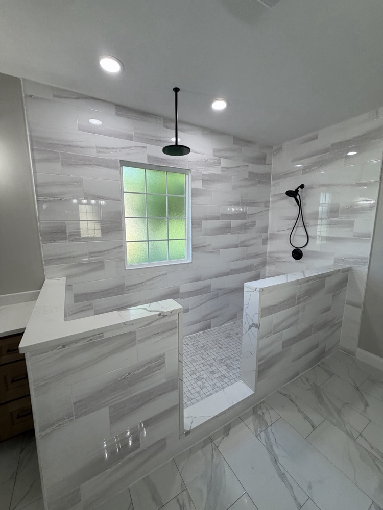 After: walk-in shower with tile half walls where the jetted tub used to be, Eaton, OH