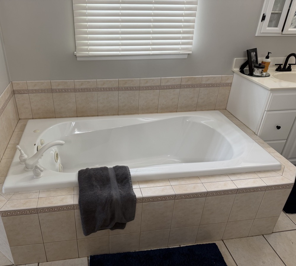 Eaton master bathroom before the remodel, with a jetted garden tub under the window