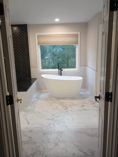 Bathroom with a white freestanding bathtub