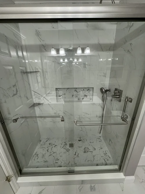Inside a shower enclosure with glass doors