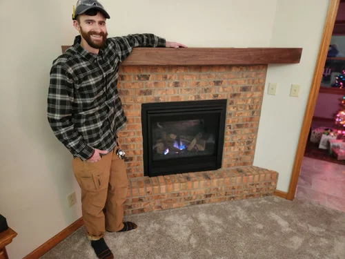 Nick framing a fireplace for a walnut mantel