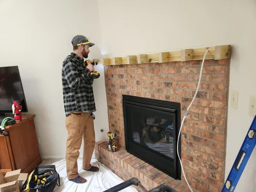 Nick installing a fireplace mantel, Centerville, OH