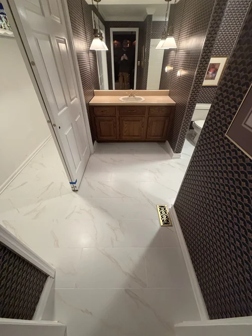 Bathroom with dark-patterned wallpaper