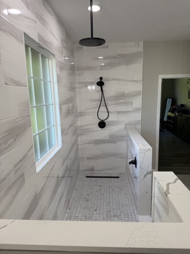 Walk-in shower with rainfall head, matte black fixtures and linear drain, Eaton, OH