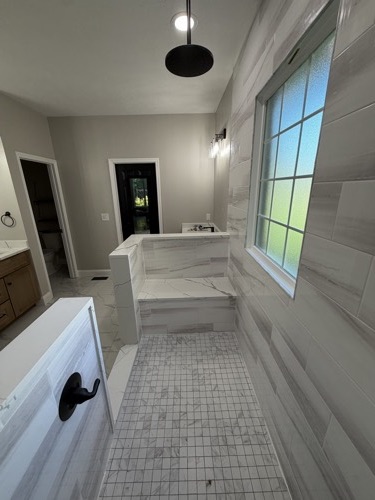 Tiled shower bench and window in a master shower, Eaton, OH