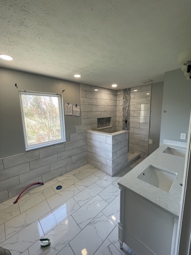 Master bathroom with curbless walk-in shower and tile pony wall, Mason, OH