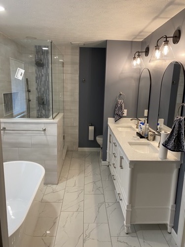 Master bathroom with glass shower and white vanity, Mason, OH