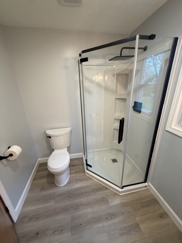 Gutted and rebuilt bathroom with corner glass shower, Brookville, OH