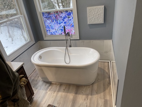 Freestanding tub under a stained-glass window, Springboro, OH
