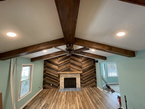 Great room with wood accent wall and beamed vaulted ceiling, Springboro, OH