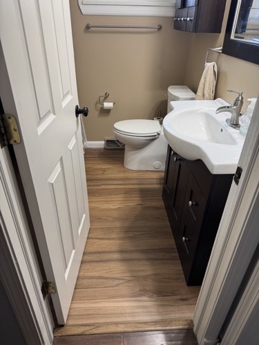 Bathroom refresh with new vanity, mirror and wood-look flooring, Beavercreek, OH