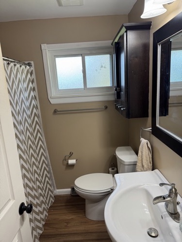 Updated bathroom with dark vanity and new lighting, Beavercreek, OH