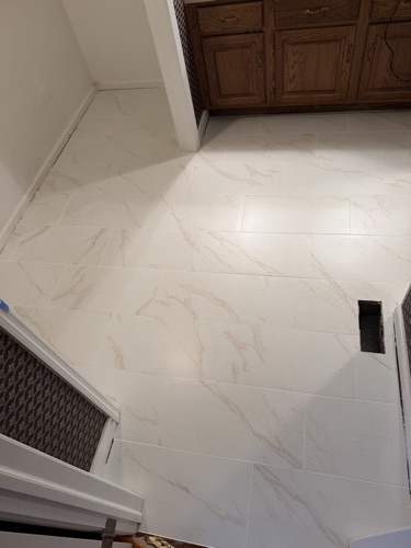 New large-format white tile floor in a bathroom, Bellbrook, OH