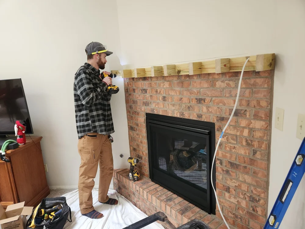 Nick Sterneberg framing a fireplace for a walnut mantel in Centerville, OH